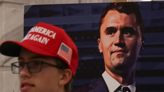 A poster of U.S. right-wing activist, commentator, Charlie Kirk, an ally of U.S. President Donald Trump, who was fatally shot during an event at Utah Valley University, as people attend a vigil for him at the Utah State Capitol, in Salt Lake City, Utah, U.S. September 10, 2025.