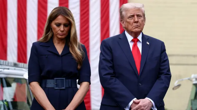 Trump and Melania stand looking solemn during a  ceremony marking the 24th anniversary of the September 11, 2001