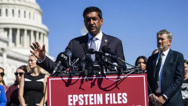 With the US capitol building in the background, Ro Khanna speaks at a podium bearing the words 'Epstein files' in white on a red background.