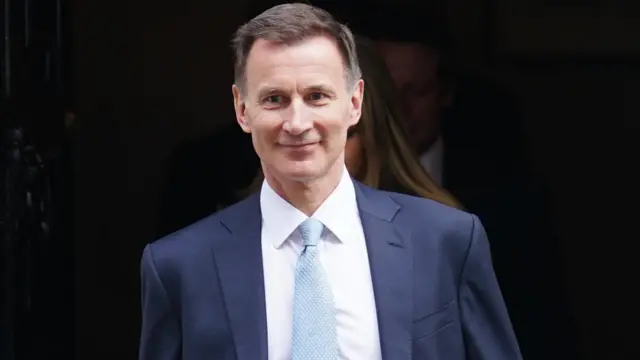 Jeremy Hunt wearing a navy suit