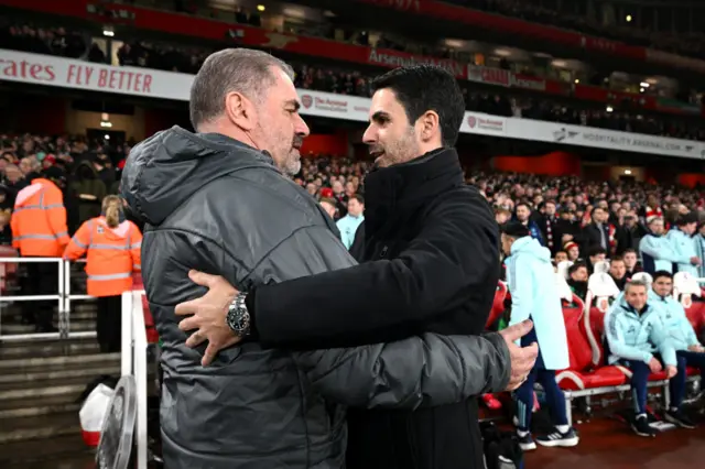 Ange Postecoglou and Mikel Arteta embracing