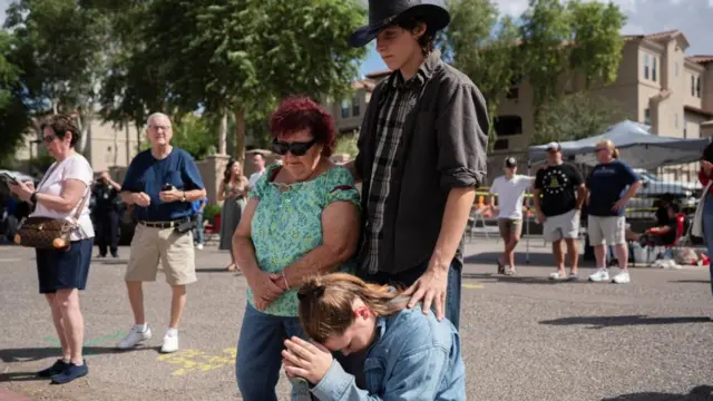 People at the memorial for Charlie Kir at Turning Point headquarters in Phoenix, Arizona.