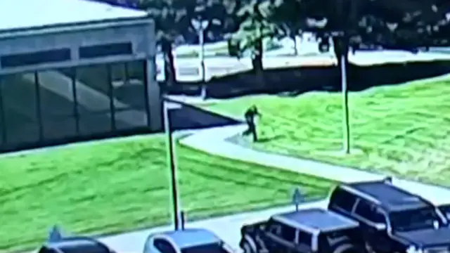 Shooter running across field