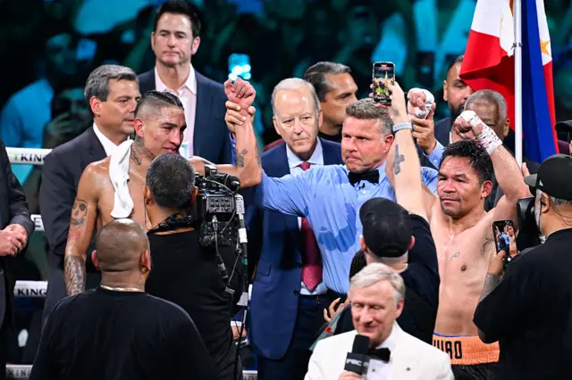 Manny Pacquiao and Mario Barrios with their hand raised
