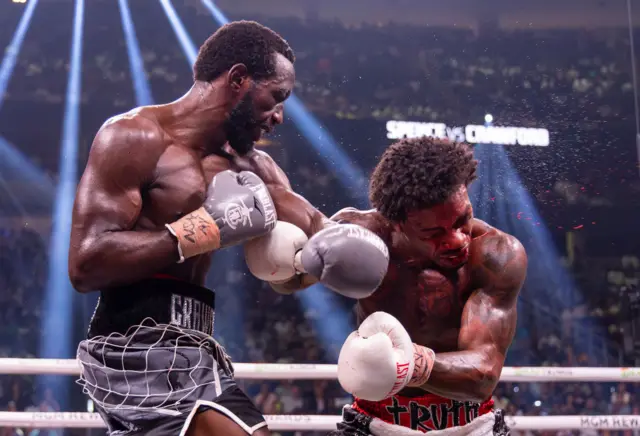 Terence Crawford punching Errol Spence