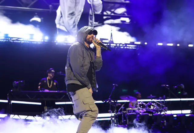 Eminem holding a microphone