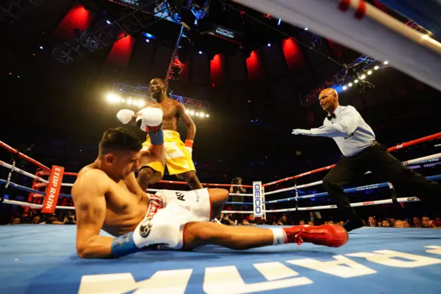 Terence Crawford with Amir Khan on the canvas