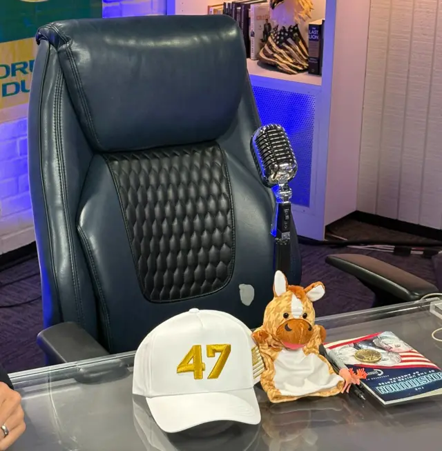 Empty chair with cap saying 47 in front of it