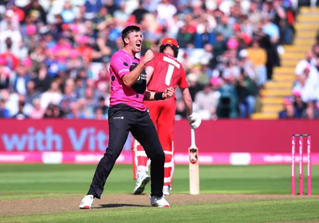 Craig Overton celebrates the wicket of Matty Hurst