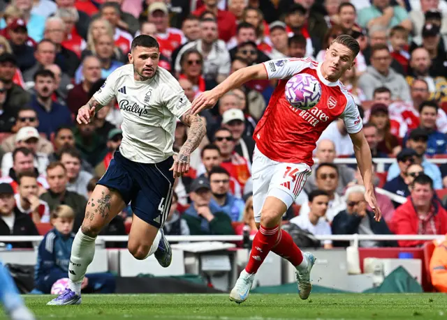 Viktor Gyoekeres of Arsenal is challenged by Morato of Nottingham Forest during the Premier League match between Arsenal and Nottingham Forest at Emirates Stadium on September 13, 2025 in London, England.