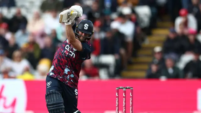 Luke Procter drives the ball