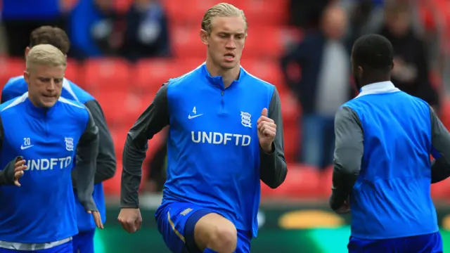 Birmingham captain Christoph Klarer warms up
