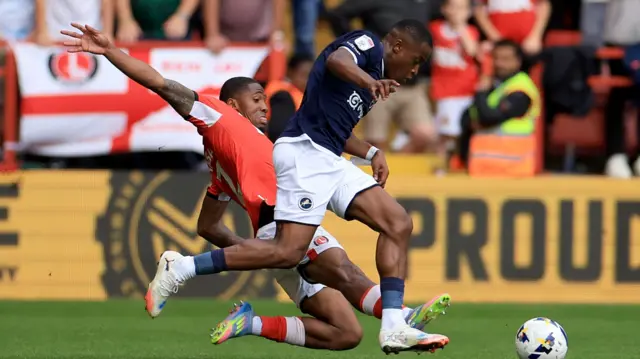 Kayne Ramsay dives in on Millwall's Aidomo Emakhu