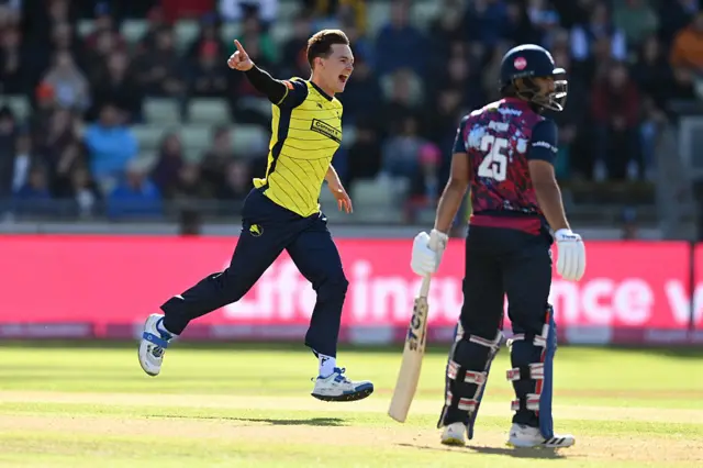 Sonny Baker celebrates taking the wicket of Ravi Bopara