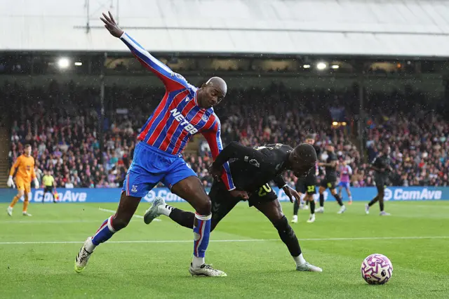Nordi Mukiele of Sunderland is fouled by Jean-Philippe Mateta of Crystal Palace during the Premier League match between Crystal Palace and Sunderland at Selhurst Park on September 13, 2025 in London, England.
