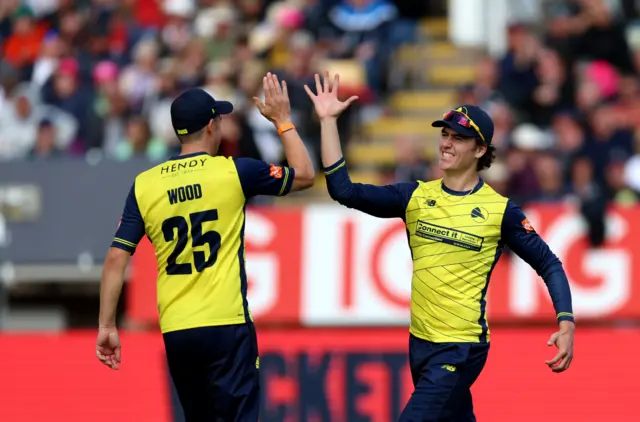 Ali Orr celebrates taking the catch to dismiss Saif Zaib