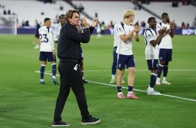 Tottenham Hotspur manager Thomas Frank applauds fans after the match