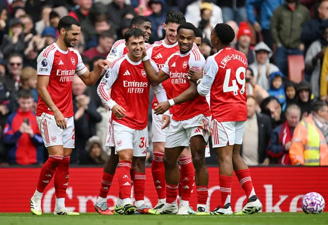 Martin Zubimendi celebrates scoring his team's third goal with teammates Mikel Merino, Jurrien Timber and Myles Lewis-Skelly of Arsenal during the Premier League match between Arsenal and Nottingham Forest at Emirates Stadium on September 13, 2025