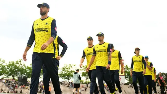 James Vince leading the Hawks on to the field