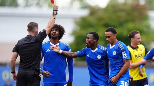 Leicester's Aaron Ramsey is shown a red card
