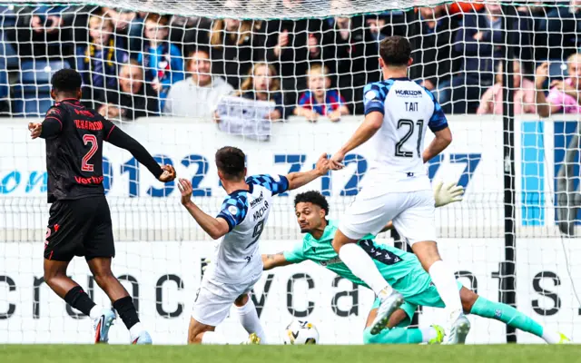 Falkirk's Ross MacIver takes a shot but it's saved by St Mirren's Shamal George before the flag goes up for offside during a William Hill Premiership match between Falkirk and St Mirren