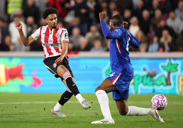 Kevin Schade of Brentford scores his team's first goal during the Premier League match between Brentford and Chelsea at Gtech Community Stadium on September 13, 2025 in Brentford, England.