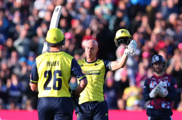 Chris Lynn celebrates reaching his century