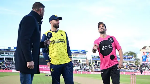 Sometset's Lewis Gregory and Hampshire's James Vince conduct the toss before the final