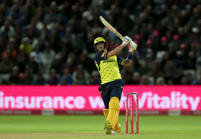 Hampshire's Benny Howell hits a six