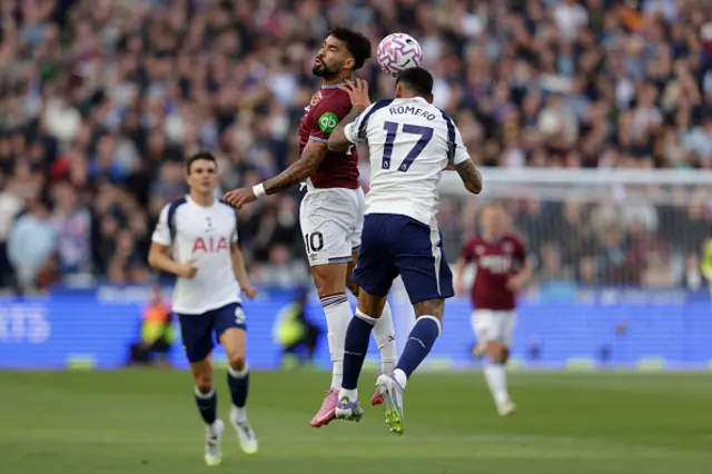 Lucas Paqueta (L) and Tottenham Hotspur's Argentinian defender #17 Cristian Romero (R) contest a high ball