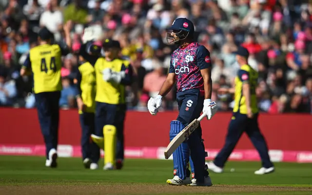 Ravi Bopara walks off after being dismissed