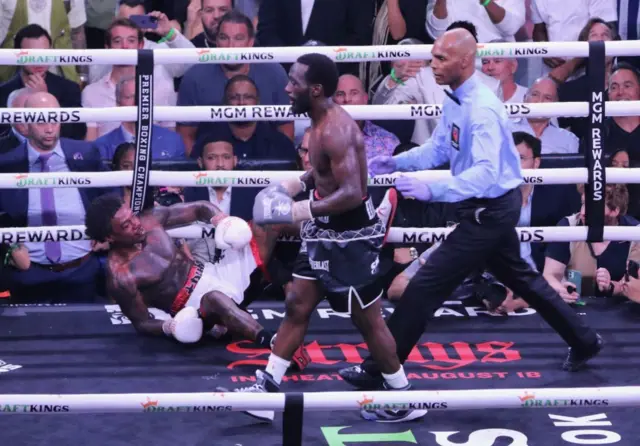 Terence Crawford walks away with Errol Spence Jr on the canvas
