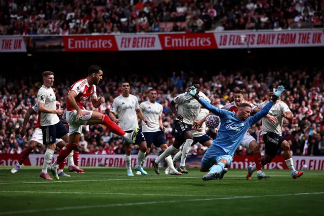 Nottingham Forest's Belgian goalkeeper #26 Matz Sels saves a shot from Arsenal's Spanish midfielder #23 Mikel Merino