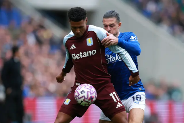 Aston Villa's Ollie Watkins in action with Everton's Jack Grealish
