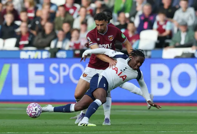 Tottenham Hotspur's Mathys Tel in action with West Ham United's Max Kilman