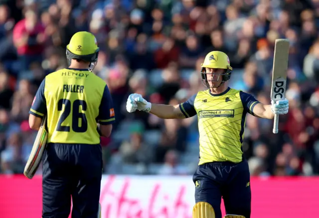 Chris Lynn celebrates reaching his century against Northants