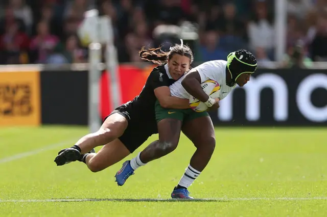 Zintle Mpupha of South Africa is tackled by Stacey Waaka of New Zealand