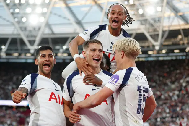 Tottenham Hotspur's Dutch defender #37 Micky van de Ven (C) celebrates scoring their third goal