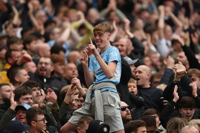 Manchester City fans celebrate after Phil Foden of Manchester City (not pictured) scored