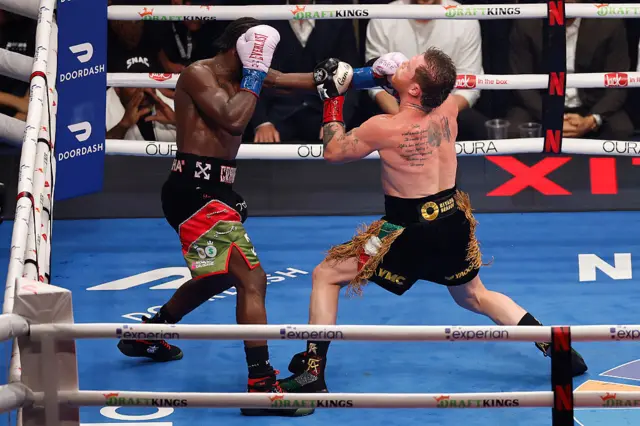 Terence Crawford punches Saul Canelo Alvarez