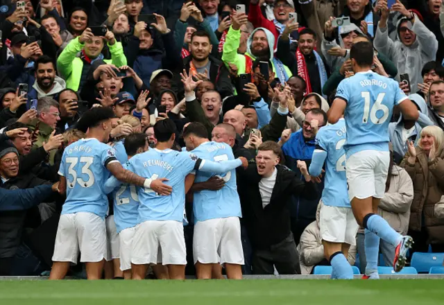 Phil Foden of Manchester City (obscured) celebrates