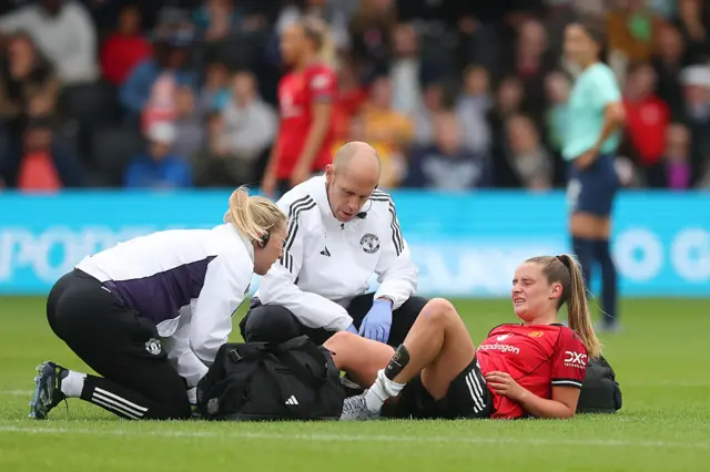 Ella Toone of Manchester United receives medical treatment