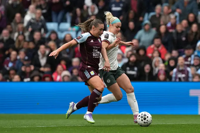 Kirsty Hanson of Aston Villa battles for possession with Ellie Carpenter of Chelsea FC