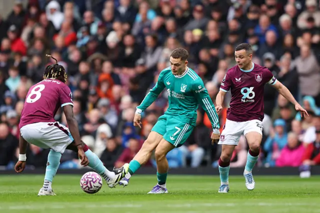 Florian Wirtz of Liverpool is challenged by Lesley Ugochukwu and Josh Cullen