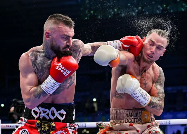 Lewis Crocker punches Paddy Donovan in a fight