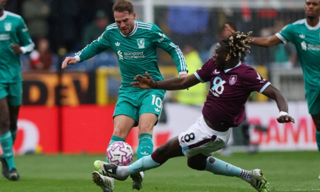 Liverpool's Alexis Mac Allister in action with Burnley's Lesley Ugochukwu
