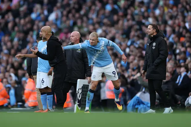 Pep Guardiola and Erling Haaland of Manchester City react