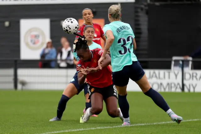 Manchester United's Melvine Malard (centre) is fouled in the box by London City Lionesses' Jana Fernandez (centre rear) for a penalt