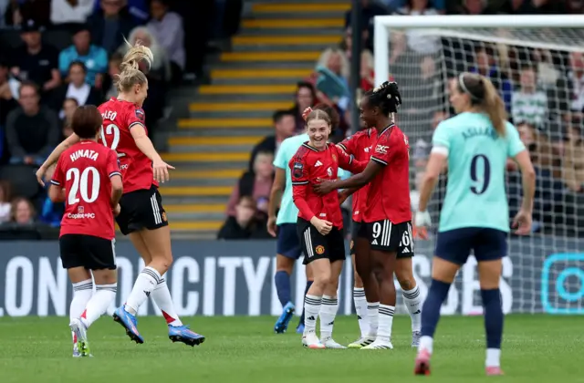 Manchester United's Jess Park (centre left) celebrates with her team mates after scoring her sides fifth goal