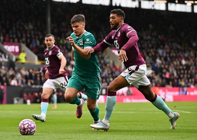 Milos Kerkez of Liverpool battles for possession with Josh Laurent